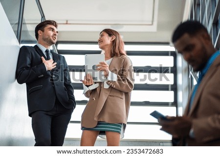Male mature caucasian ceo businessman leader with diverse coworkers team executive managers group meeting. Multicultural professional businesspeople working together on research plan boardroom.
