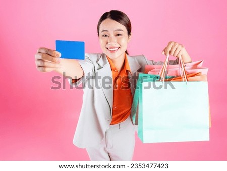 Photo of young Asian businesswoman on background