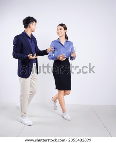 Photo of two young Asian business people on white background Royalty-Free Stock Photo #2353482899