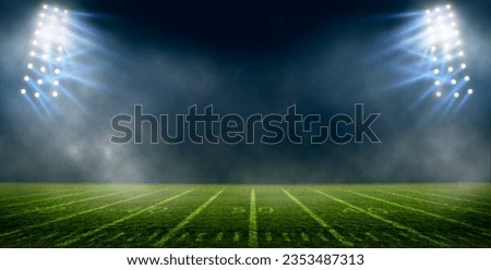 Football field illuminated by stadium lights, american football stadium	
