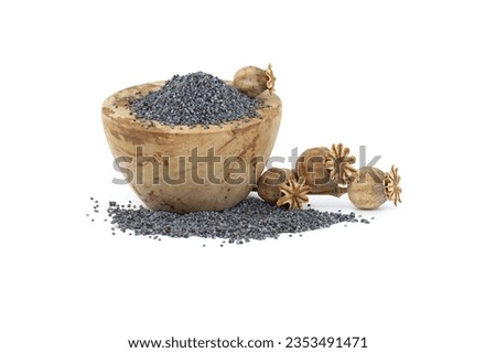 Poppy seeds in wooden bowl and seed pods isolated on white background, full depth of field