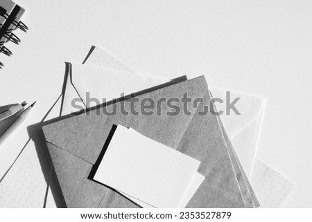 Workplace. Papers, Stationery, Notebooks on Desk, Top View. Monochrome Business Mockup.