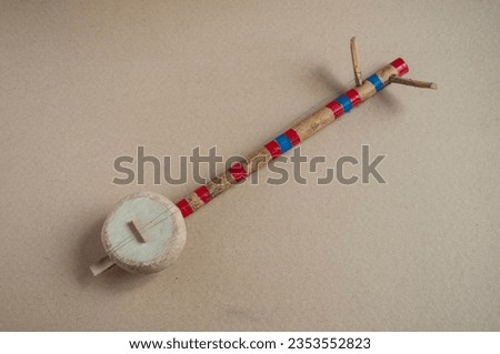 The traditional folk toy music instrument called '' Dotara'' in bengali language often used by the bauls communities of west Bengal, but this is only a toy used as decorative piece. Royalty-Free Stock Photo #2353552823