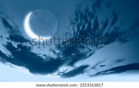 Ramadan Concept - Abstract background with Crescent moon over the sunset clouds Royalty-Free Stock Photo #2353563817