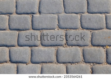 Dark grey brick floor background, Abstract geometric pattern, Grizzly brick block texture, Outdoor pavement or footpath, Can be used as background for display or montage products.