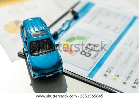 Front view of a blue toy car on sheets drawings
