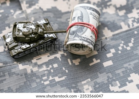 Army identification medallions and dollar bills on United states flag. Military pension, salary in the army or military insurance Royalty-Free Stock Photo #2353566047