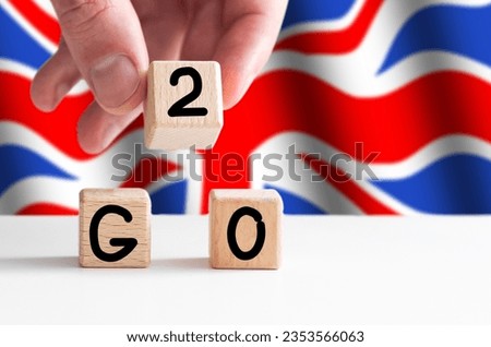 Union Jack flag and the word British in wooden letters on a blue background G20 