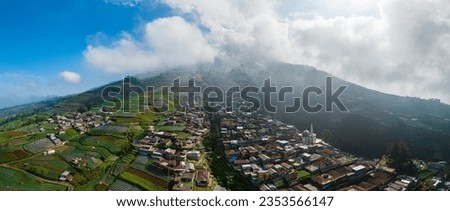 Aerial View panorama of colorful stack building houses in Nepal van Java village and Mount Sumbing, Java, Indonesia