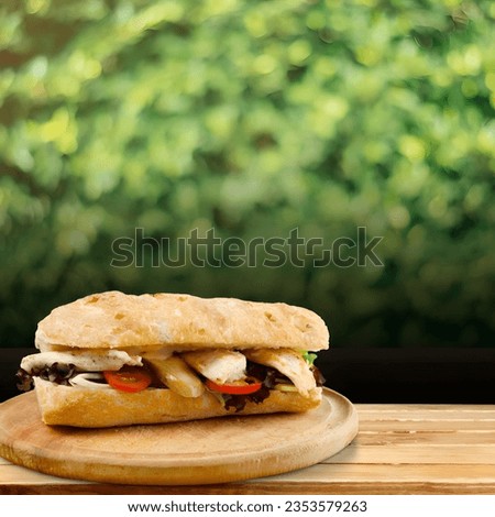 sandwiches filled with meat and vegetables are served on the table