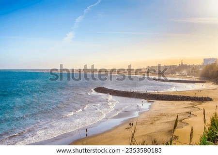 Scenic Sunset View of Playa del Ingles Beach in Maspalomas With Sand Dunes and Rocks on Shore at Gran Canaria in Spain. Horizontal Image Royalty-Free Stock Photo #2353580183