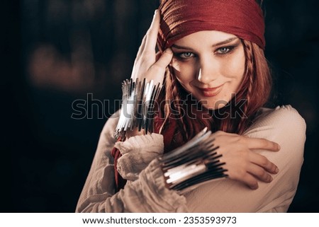 Outdoor portrait of young female in pirate costume
