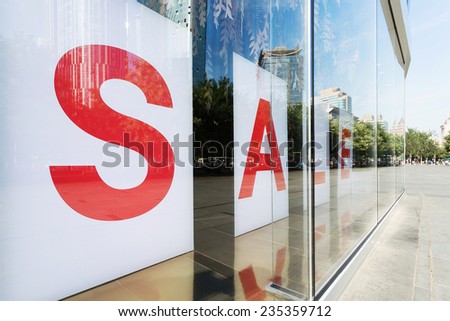 sale poster in shop  exhibition window