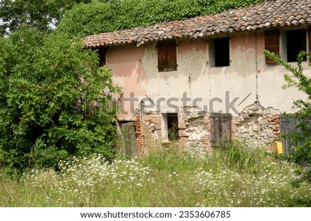old abandoned stone house in the woods in the Italian countryside Royalty-Free Stock Photo #2353606785