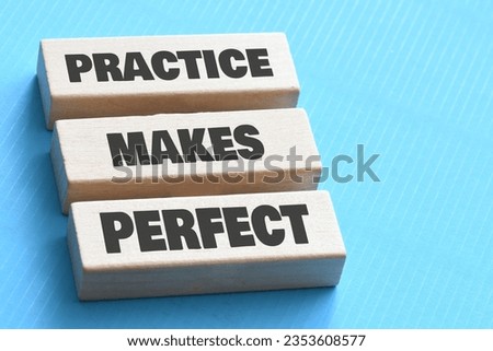 Practice makes perfect symbol. Concept words Practice makes perfect on wooden block.