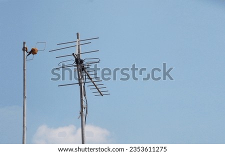 UHF television antena with background blue sky