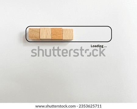 Loading bar. Wooden cube block shape in progress bar with loading text isolated on white background Royalty-Free Stock Photo #2353625711