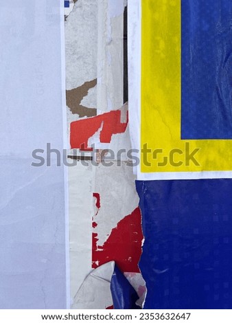 Multicoloured urban street poster placard paper layers close up texture  Royalty-Free Stock Photo #2353632647