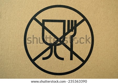 Unsafe materials for food contact warning sign, printed on a cardboard box