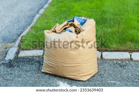 Discarded trash and debris in urban alley, symbolizing neglect, environmental impact, and the throwaway culture of modern society Royalty-Free Stock Photo #2353639403