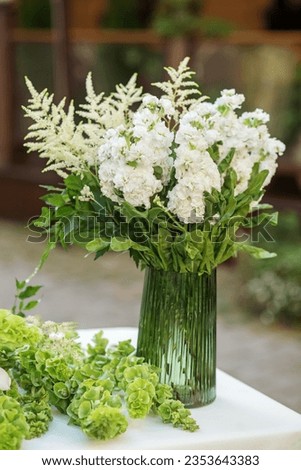 Floral decor for events. Fresh white Matthiola or Stocks flowers in vase.