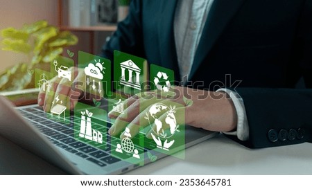 Businessman analyze investment sustainability ESG icons. ESG environmental protection concept, sustainable development, climate change, green energy recycle, Net zero and carbon neutral. Royalty-Free Stock Photo #2353645781