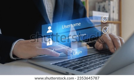 Businessman use laptop login register username and password identity on virtual screen of cyber security, data protection and secured internet access, cybersecurity.
