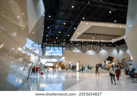 Blurred images of trade fairs in the big hall. image of people walking on a trade fair exhibition or expo where business people show innovation activity and present products in a big hall. Royalty-Free Stock Photo #2353654827