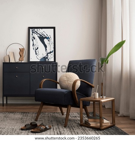 Elegant interior with mock up poster frame, blue armchair, commode, brown sofa, carpet, decoration, side table and personal accessories. Stylish home decor. Template.
