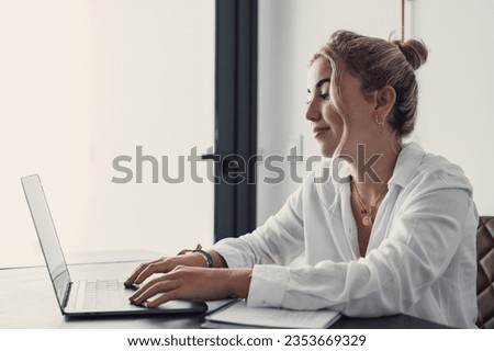 Head shot pleasant happy young woman freelancer studying on computer at home. Attractive businesswoman studying online, using laptop software, web surfing information or shopping in internet store. Royalty-Free Stock Photo #2353669329