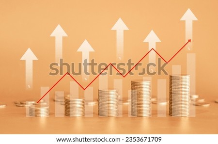 Stack of golden money coin on yellow background with graph and red up arrow. Business and financial background concept. Royalty-Free Stock Photo #2353671709