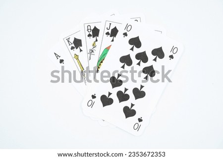 Royal straight flush playing cards poker hand in spade isolated on white background.