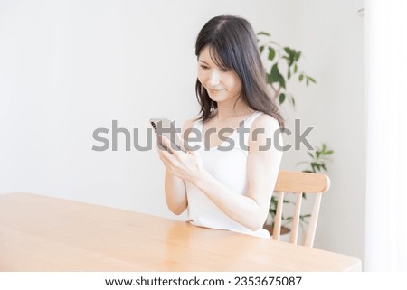 Japanese woman scrolling mobile phone
