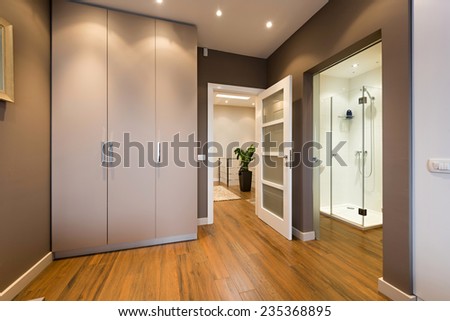 Modern anteroom interior with a view to a bathroom  Royalty-Free Stock Photo #235368895