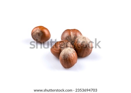 Hazelnuts nuts filberts isolated on white background Royalty-Free Stock Photo #2353694703