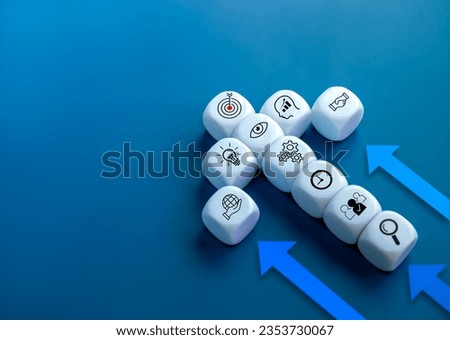 The leader, Business strategy element icon on white cube block arranged as heading arrows shape on blue background with copy space. Business growth success process, leadership and startup concepts.