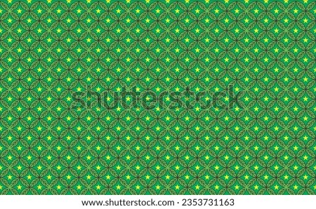 leaf-shaped pattern of shades of green, with yellow stars