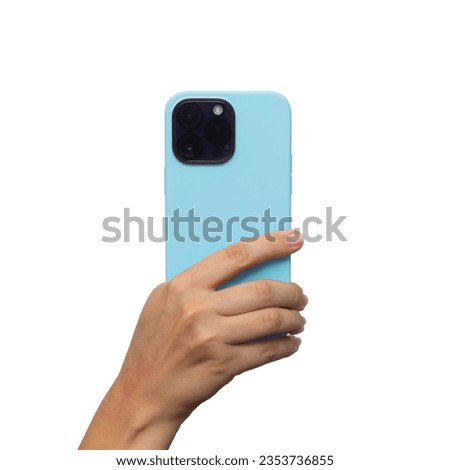 Mobile phone with 3 photo cameras in a blue case in female hand isolated on a white background. Blank with an empty copy space for the design. Mockup of a smartphone. A young woman takes picture
