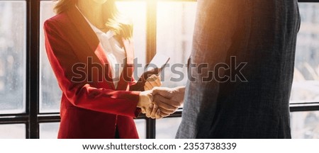 Business handshake for teamwork of business merger and acquisition,successful negotiate,hand shake,two businessman shake hand with partner to celebration partnership and business deal concept Royalty-Free Stock Photo #2353738339