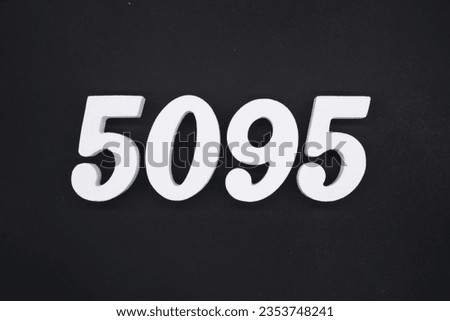 Black for the background. The number 5095 is made of white painted wood.