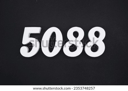 Black for the background. The number 5088 is made of white painted wood.