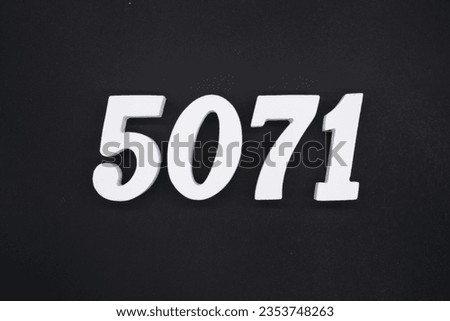 Black for the background. The number 5071 is made of white painted wood.