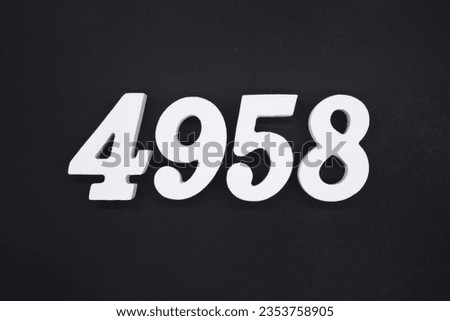 Black for the background. The number 4958 is made of white painted wood.