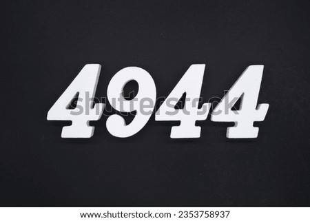 Black for the background. The number 4944 is made of white painted wood.