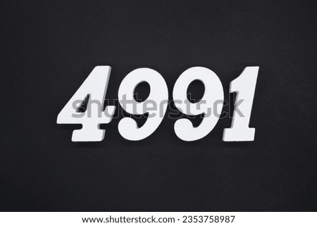 Black for the background. The number 4991 is made of white painted wood.