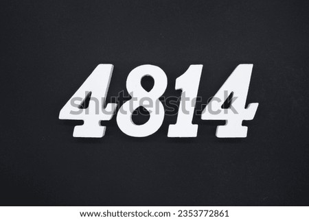 Black for the background. The number 4814 is made of white painted wood.