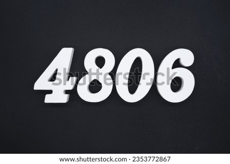 Black for the background. The number 4806 is made of white painted wood.
