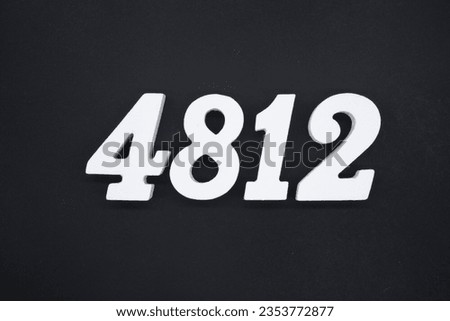 Black for the background. The number 4812 is made of white painted wood.
