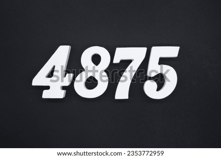 Black for the background. The number 4875 is made of white painted wood.