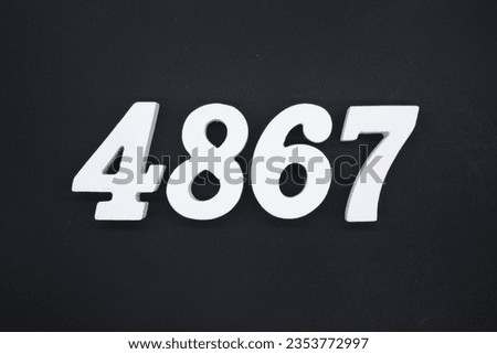 Black for the background. The number 4867 is made of white painted wood.